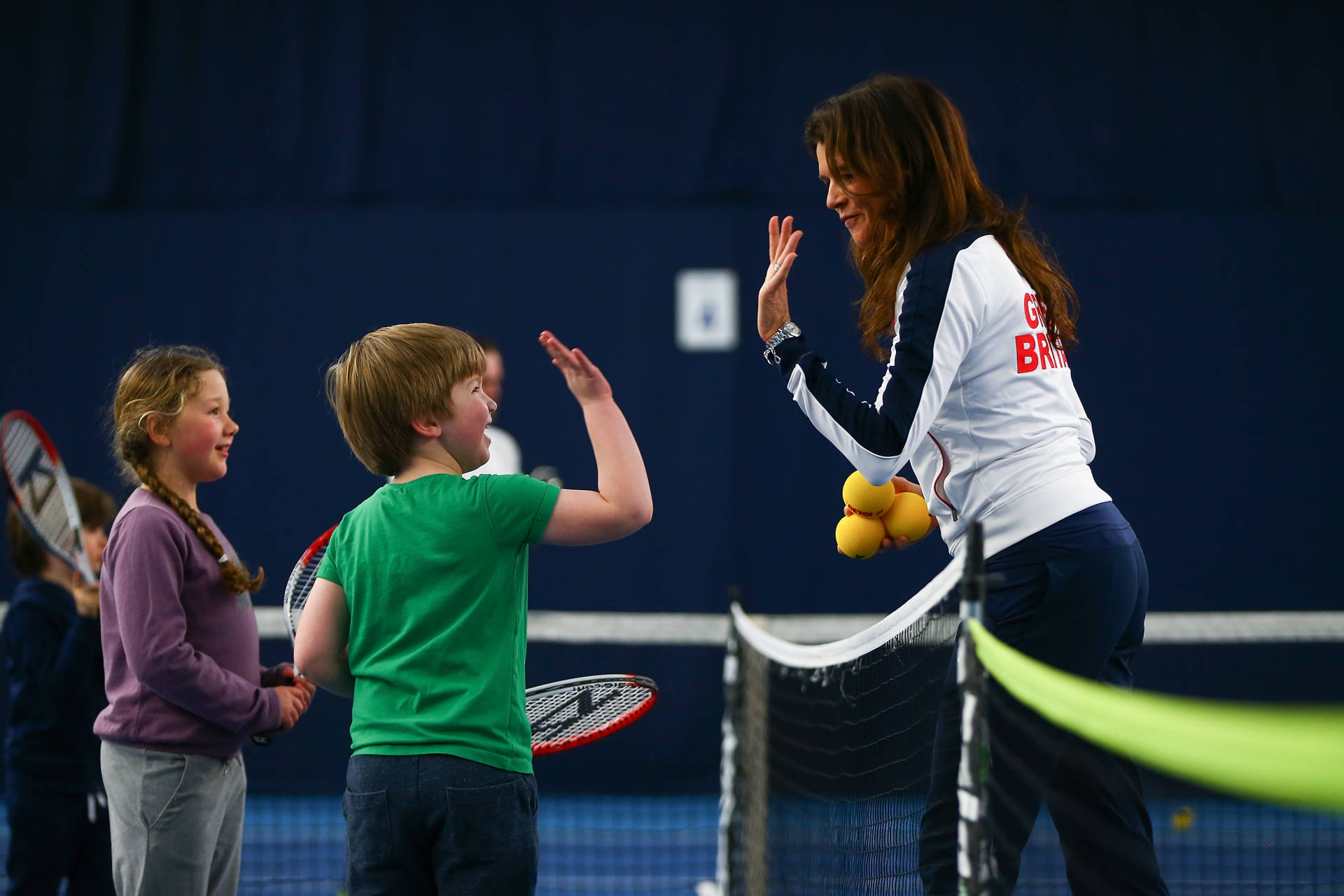 "BIRMINGHAM, ENGLAND - MARCH 05: Tennis for Kids with Annabel Croft during day two of the Davis Cup World Group first round tie between Great Britain and Japan at Barclaycard Arena on March 5, 2016 in Birmingham, England. (Photo by Jordan Mansfield/Getty Images for LTA)"